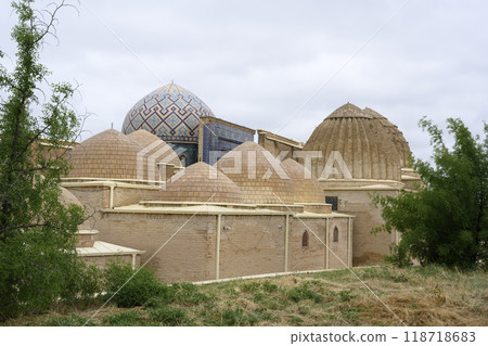 Domes of mausoleums in medieval Shahi-Zinda complex among dry grass in Samarkand, Uzbekistan Domes of mausoleums in medieval Shahi-Zinda complex among dry grass in Samarkand, Uzbekistan 118718683