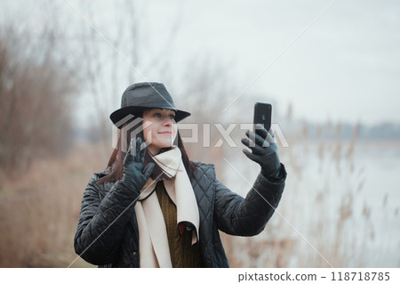 A woman communicates via video A woman communicates via video 118718785