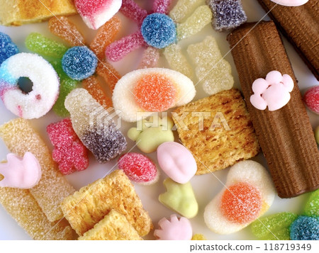 Background of colorful gummy and soft candies and baked goods Background of colorful gummy and soft candies and baked goods 118719349
