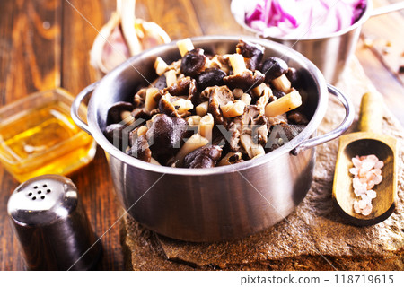 marinated mushrooms in metal bowl marinated mushrooms in metal bowl 118719615