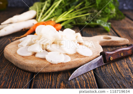 White radish on wooden board White radish on wooden board 118719634