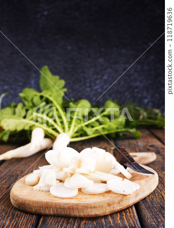 White radish on wooden board White radish on wooden board 118719636