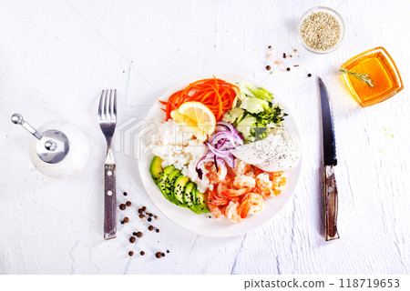 Lunch diet - rice, shrimp, avocado in one plate on a light background 118719653