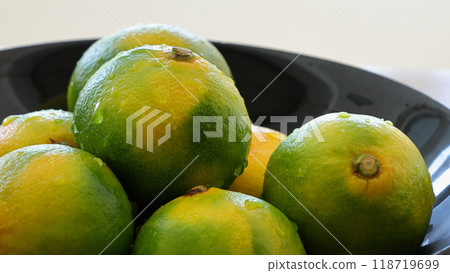 Autumn fruits in season: Assortment of very early Unshu mandarins Autumn fruits in season: Assortment of very early Unshu mandarins 118719699