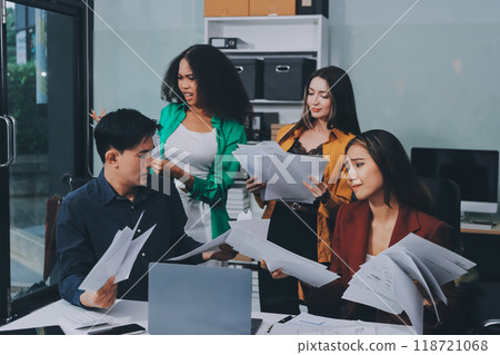 Stress, business people and employee frustrated with multitasking, pressure or overworked by team in chaos with paperwork. Anxiety, headache and worker overwhelmed by group and burnout in crisis 118721068