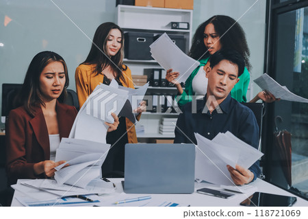 Stress, business people and employee frustrated with multitasking, pressure or overworked by team in chaos with paperwork. Anxiety, headache and worker overwhelmed by group and burnout in crisis 118721069