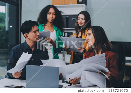 Stress, business people and employee frustrated with multitasking, pressure or overworked by team in chaos with paperwork. Anxiety, headache and worker overwhelmed by group and burnout in crisis 118721070