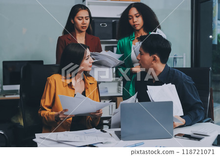 Stress, business people and employee frustrated with multitasking, pressure or overworked by team in chaos with paperwork. Anxiety, headache and worker overwhelmed by group and burnout in crisis 118721071