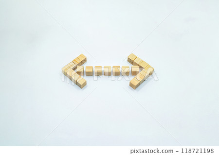 A three-dimensional cypress wood cube mark pointing left and right on a white background A three-dimensional cypress wood cube mark pointing left and right on a white background 118721198