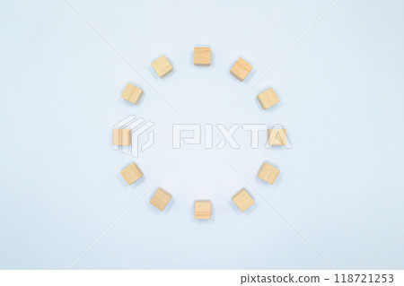 A frame of 12 hinoki wood cubes arranged in a circle on a white background A frame of 12 hinoki wood cubes arranged in a circle on a white background 118721253