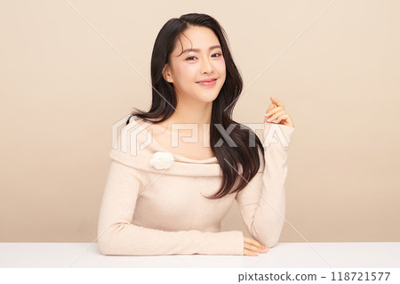 Beautiful young asian woman with clean fresh skin on beige background, Face care, Facial treatment, Cosmetology, beauty and spa, Asian women portrait. Beautiful young asian woman with clean fresh skin on beige background, Face care, Facial treatment, Cosmetology, beauty and spa, Asian women portrait. 118721577