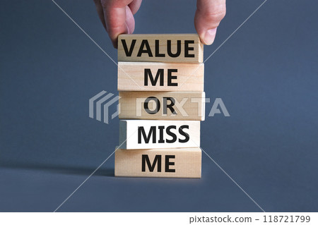Value or miss me symbol. Concept words Value me or miss me on wooden block. Beautiful grey table grey background. Businessman hand. Business psychological and value or miss me concept. Copy space. Value or miss me symbol. Concept words Value me or miss me on wooden block. Beautiful grey table grey background. Businessman hand. Business psychological and value or miss me concept. Copy space. 118721799