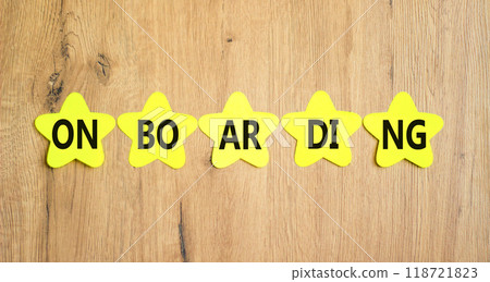 Onboarding success symbol. Concept word Onboarding on yellow paper stars. Beautiful wooden background. Business onboarding success concept. Copy space. Onboarding success symbol. Concept word Onboarding on yellow paper stars. Beautiful wooden background. Business onboarding success concept. Copy space. 118721823