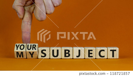 My or your subject symbol. Businessman turns wooden cubes and changes the word my subject to your subject. Beautiful orange table, orange background. Business, my or your subject concept. Copy space. 118721857