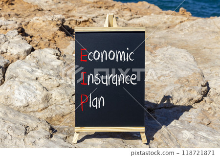 EIP economic insurance plan symbol. Concept words EIP economic insurance plan on beautiful yellow blackboard. Beautiful stone sea background. Business EIP economic insurance plan concept. Copy space. 118721871