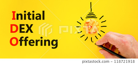 IDO initial DEX offering symbol. Concept words IDO initial DEX offering on beautiful yellow paper. Beautiful yellow background. Businessman hand. Business IDO initial DEX offering concept. Copy space. 118721918