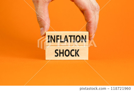 Inflation shock symbol. Concept words Inflation shock on wooden blocks. Beautiful orange table orange background. Businessman hand. Business inflation shock concept. Copy space. Inflation shock symbol. Concept words Inflation shock on wooden blocks. Beautiful orange table orange background. Businessman hand. Business inflation shock concept. Copy space. 118721960