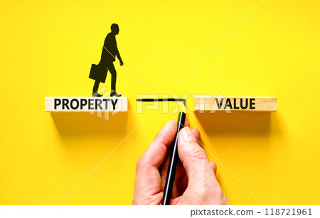 Property value symbol. Concept words Property value on beautiful wooden blocks. Businessman icon. Beautiful yellow table yellow background. Business property value concept. Copy space. Property value symbol. Concept words Property value on beautiful wooden blocks. Businessman icon. Beautiful yellow table yellow background. Business property value concept. Copy space. 118721961