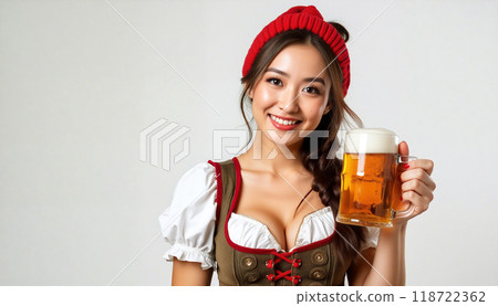 Beautiful asian woman wearing traditional dirndl holding beer glass smiling 118722362