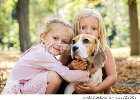 Friends with a beagle dog on autumn background Friends with a beagle dog on autumn background 118722502