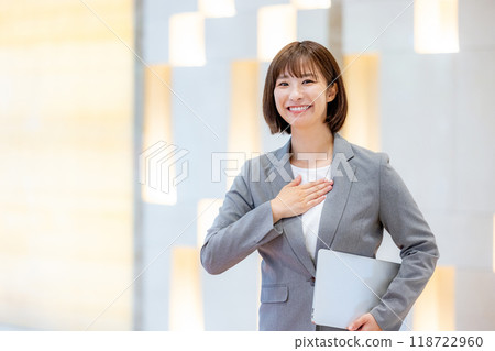 A woman with a laptop computer. Photo courtesy of Denpa Gakuen, Tokyo Electronics College. 118722960