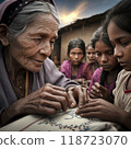An elderly woman proudly teaches young girls traditional embroidery. Her weathered hands guide young girls, passing on cultural heritage in a simple village setting filled with warmth. 118723070