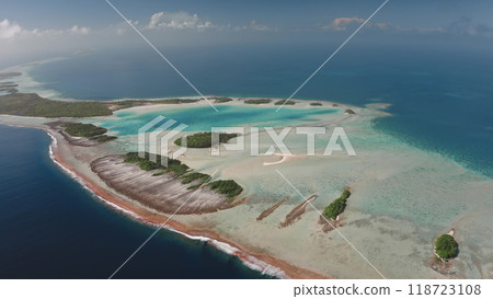 Breathtaking aerial perspective of Rangiroa island, the largest atoll in Tuamotus. Vibrant turquoise lagoon, intricate coral reefs, and abundant greenery. Remote untouched places, travel destination Breathtaking aerial perspective of Rangiroa island, the largest atoll in Tuamotus. Vibrant turquoise lagoon, intricate coral reefs, and abundant greenery. Remote untouched places, travel destination 118723108