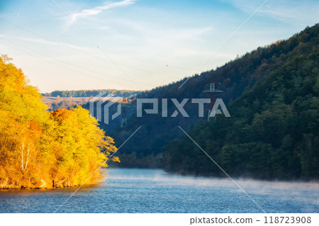 autumn landscape with lake in mountains. romania, europe. scenery in fall colors reflecting in the calm water in morning light 118723908