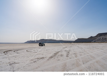 Driving through Tuzbayil Salt Lake in Mangistau, Kazakhstan Driving through Tuzbayil Salt Lake in Mangistau, Kazakhstan 118724001