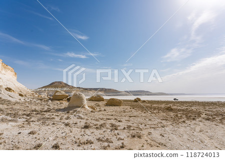 Driving through Tuzbayil Salt Lake in Mangistau, Kazakhstan 118724013