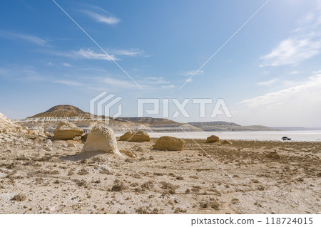 Driving through Tuzbayil Salt Lake in Mangistau, Kazakhstan 118724015
