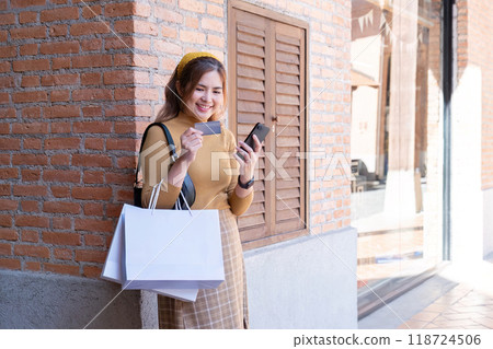 Eager Shopper Preparing for Online Black Friday Deals with Credit Card 118724506