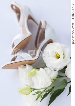 White wedding sandals with white flowers. Selective focus. 118724717