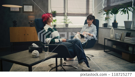 Girl and her doctor meet in psychotherapist's office Girl and her doctor meet in psychotherapist's office 118725277