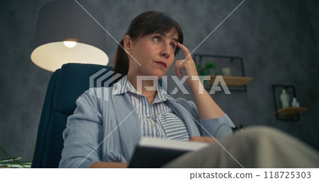 Close up of professional therapist listening to patient, taking notes 118725303
