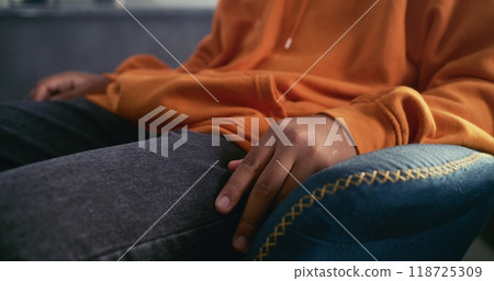 Close up of African American teenage boy gesturing during communication with psychologist 118725309