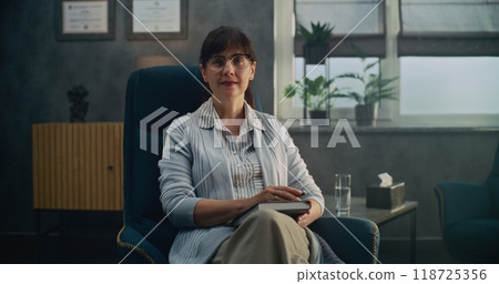 Portrait of female psychologist smiling and looking at camera 118725356