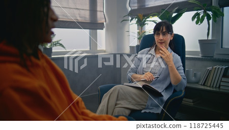 Meeting of psychotherapist with African American boy 118725445