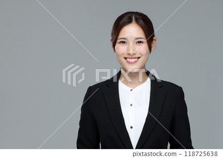 Young woman in a suit Young woman in a suit 118725638
