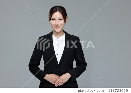 Young woman in a suit 118725639
