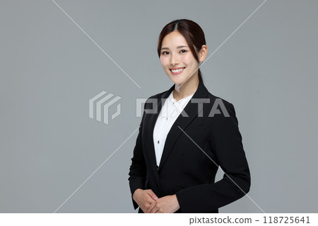 Young woman in a suit Young woman in a suit 118725641