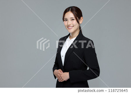 Young woman in a suit Young woman in a suit 118725645