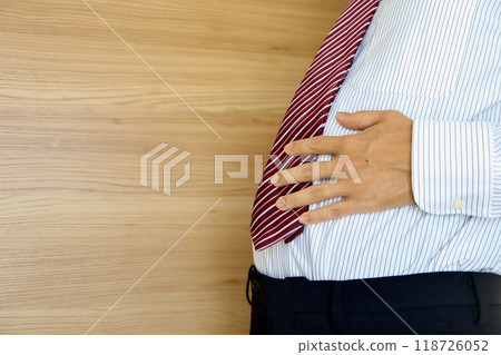A businessman with a belly 118726052