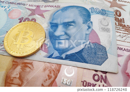 Bitcoin on top of a stack of Turkish lira 118726248