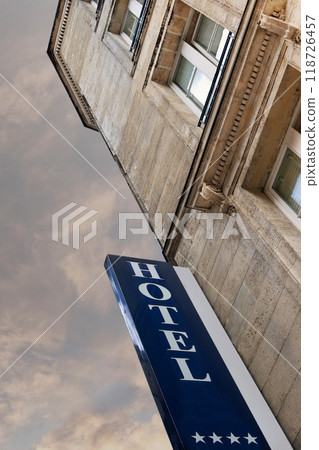 Hotel sign on a stone facade 118726457