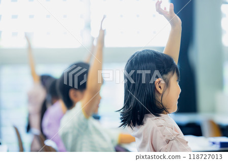 Elementary school students taking lessons in a classroom Elementary school students taking lessons in a classroom 118727013