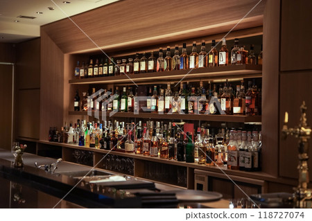 Western liquor lined up on the bar counter and the counter 118727074