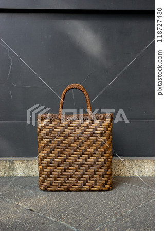 A walnut basket bag that matches a kimono photographed outdoors A walnut basket bag that matches a kimono photographed outdoors 118727480