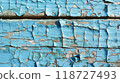 Peeling blue paint on wooden surface 118727493