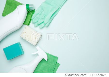 Cleaning supplies and tools, including bottles, gloves, sponges, and cloths. Concept of cleanliness and hygiene 118727823